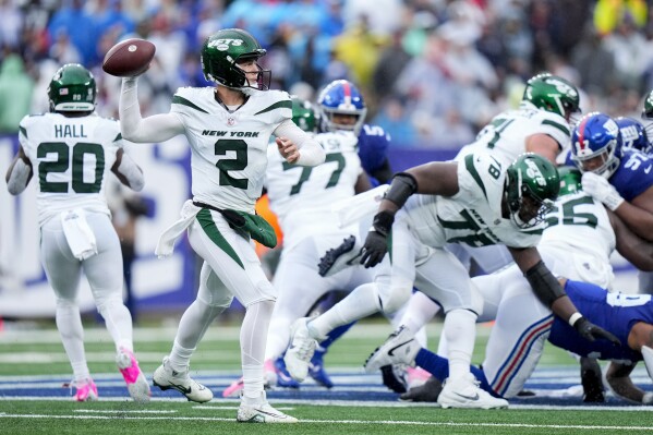 New York Jets quarterback Zach Wilson (2) passes the ball during the first half of an NFL football game against the New York Giants, Sunday, Oct. 29, 2023, in East Rutherford, N.J. (AP Photo/Frank Franklin II)