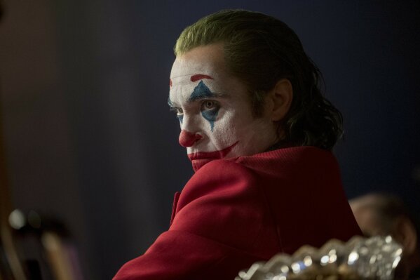 This image released by Warner Bros. Pictures shows Joaquin Phoenix in a scene from "Joker." On Monday, Dec. 9, 2019, Phoenix was nominated for a Golden Globe for best actor in a motion picture drama for his role in the film. (Niko Tavernise/Warner Bros. Pictures via AP)