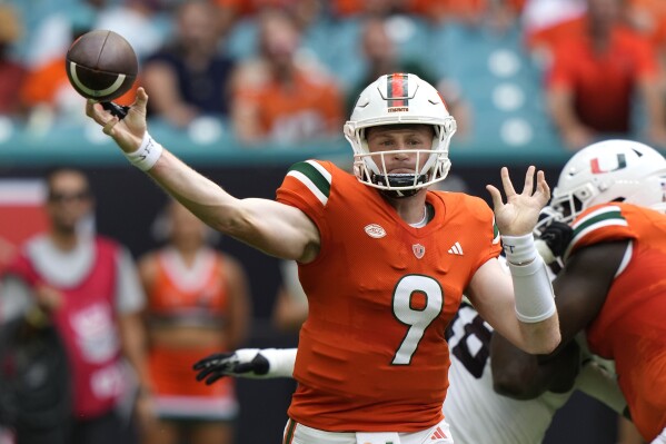 Miami Hurricanes quarterback Tyler Van Dyke (9) passes during the first half of an NCAA college football game against Texas A&M, Saturday, Sept. 9, 2023, in Miami Gardens, Fla. (AP Photo/Lynne Sladky)