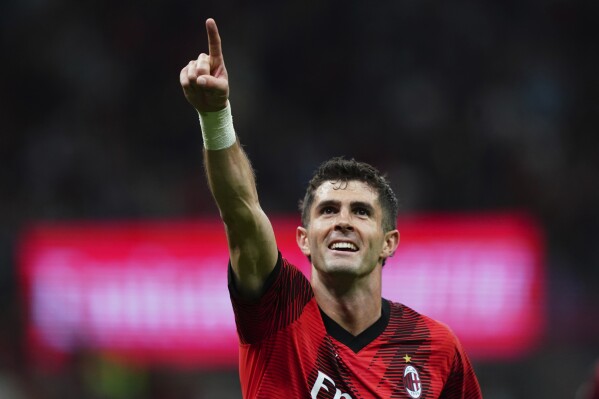 AC Milan's Christian Pulisic celebrates after scoring his side's second goal during the Serie A soccer match between AC Milan and Cagliari at the San Siro stadium, in Milan, Italy, Saturday, May 11, 2024. (Spada/LaPresse via AP)