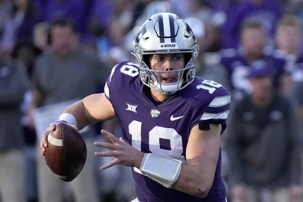 FILE - Kansas State quarterback Will Howard looks to pass during the second half of an NCAA college football game against Oklahoma State Saturday, Oct. 29, 2022, in Manhattan, Kan. Kansas State opens their season at home against Southeast Missouri State on Sept. 2.(AP Photo/Charlie Riedel, File)