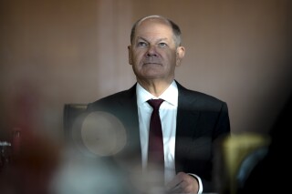 German Chancellor Olaf Scholz arrives for a cabinet meeting at the chancellery in Berlin, Germany, Wednesday, Jan. 10, 2024. (AP Photo/Markus Schreiber)