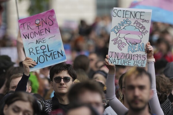 Campaigners take part in a rally organised by trans rights groups, trade unions, and community organisations following the Supreme Court ruling on the definition of a woman in equalities law, at Parliament Square, central London, Saturday April 19, 2025. (AP Photo/Alastair Grant, File)
