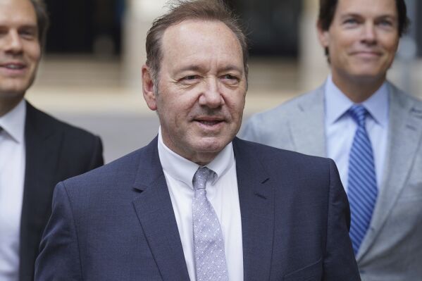 US Actor Kevin Spacey, center, arrives at Southwark Crown Court, London, Tuesday, July 4, 2023. Spacey is charged with three counts of indecent assault, seven counts of sexual assault, one count of causing a person to engage in sexual activity without consent and one count of causing a person to engage in penetrative sexual activity without consent between 2001 and 2005. (Lucy North/PA via AP)