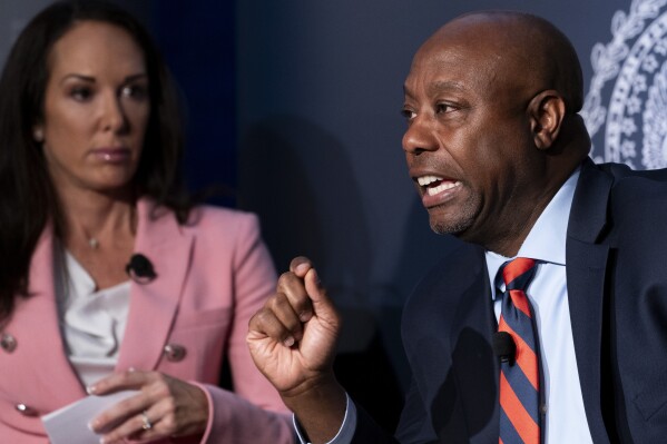 Republican presidential candidate Sen. Tim Scott, R-S.C., right, answers questions next to AP National Politics Reporter Meg Kinnard, left, moderating, during an Associated Press 2024 GOP Presidential Candidates Conversations on National Security and Foreign Policy event, held in partnership with Georgetown University's Institute of Politics and Public Service, at Georgetown University in Washington, Monday, Oct. 16, 2023. (AP Photo/Stephanie Scarbrough)