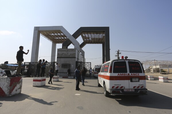 Palestinian ambulances with people wounded in the Israeli bombing of the Gaza Strip arrive at the border crossing with Egypt on Wednesday, Nov. 1, 2023. (AP Photo/Hatem Ali)