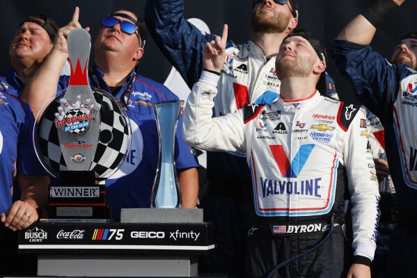 William Byron points skyward following a win in a NASCAR Cup Series auto race in Watkins Glen, N.Y., Sunday, Aug. 20, 2023. (AP Photo/Jeffrey T. Barnes)