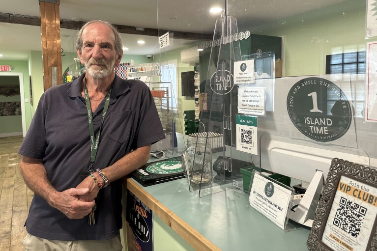 Geoff Rose, owner of the Island Time cannabis dispensary, poses in his store on June 3, 2024, in Vineyard Haven, Mass. Unless something changes, Martha's Vineyard is about to run out of pot, affecting more than 230 registered medical users and thousands more recreational ones. (AP Photo/Nick Perry)