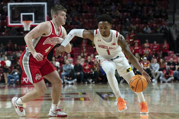 Maryland's Jahmir Young, right, drives the ball against Ohio State's Sean McNeil, left, during the second half of an NCAA college basketball game, Sunday, Jan. 8, 2023, in College Park, Md. (AP Photo/Jose Luis Magana)