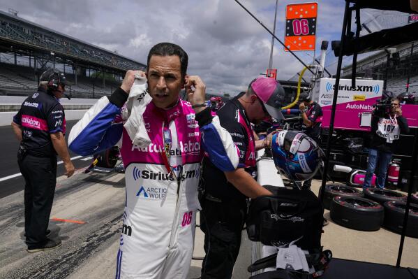 Helio Castroneves, of Brazil, prepares to drive before the final practice for the Indianapolis 500 auto race at Indianapolis Motor Speedway in Indianapolis, Friday, May 27, 2022. (AP Photo/Michael Conroy)