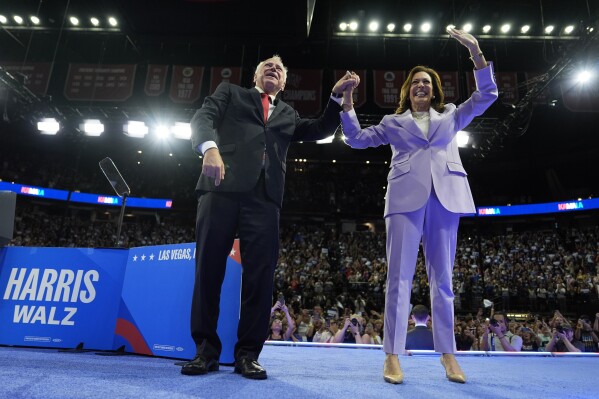 Democratic presidential nominee Vice President Kamala Harris, right, and running mate Minnesota Gov. Tim Walz are pictured at a campaign rally, Saturday, Aug. 10, 2024, in Las Vegas. (AP Photo/Julia Nikhinson)