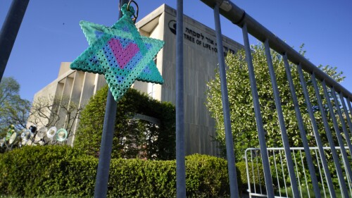 FILE - A Star of David hangs from a fence outside the dormant landmark Tree of Life synagogue in Pittsburgh's Squirrel Hill neighborhood, Apr. 19, 2023. Robert Bowers. Bowers, the gunman who massacred 11 worshippers at a Pittsburgh synagogue in 2018, has a “very serious mental health history" from childhood and a “markedly abnormal” brain, a defense expert testified Wednesday, June 28, 2023, in the penalty phase of the Bowers' trial. (AP Photo/Gene J. Puskar, File)