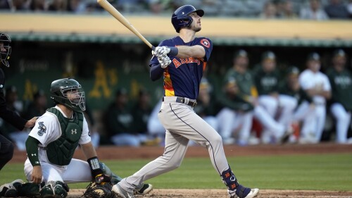 Houston Astros' Kyle Tucker, right, watches his two-run home run during the fifth inning of a baseball game against the Oakland Athletics, Friday, July 21, 2023, in Oakland, Calif. (AP Photo/Godofredo A. Vásquez)