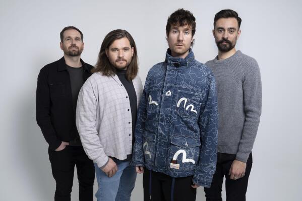 Will Farquarson, from left, Chris Wood, Dan Smith and Kyle Simmons of Bastille pose for a portrait to promote the album "Give Me the Future" on Wednesday, Jan. 5, 2022 in London. The band's 13-track, fourth studio album, dives into the world of science-fiction, exploring the way technology can be a tool for escape. (Photo by Scott Garfitt/AP)