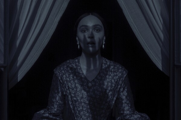 This imaged released by Focus Features shows Lily-Rose Depp in a scene from "Nosferatu". (Focus Features via AP)