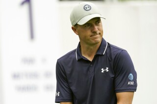 FILE - Jordan Spieth walks on the the first tee during the first round of the St. Jude Championship golf tournament Thursday, Aug. 10, 2023, in Memphis, Tenn. Jordan Spieth is replacing Rory McIlroy on the PGA Tour policy board and will finish out the term that runs until the end of next year. PGA Tour Commissioner Jay Monahan announced the move to players on Monday morning, Nov. 20. (AP Photo/George Walker IV, File)