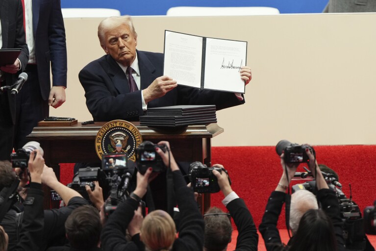 Trump sets out to erase Biden’s legacy with pardons and orders immediately after taking office