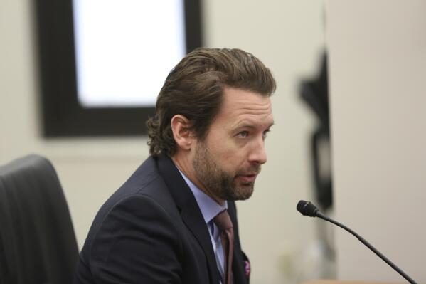 Former Democratic U.S. Rep. Joe Cunningham testifies before a South Carolina Senate subcommittee considering new maps for U.S. House districts on Monday, Nov. 29, 2021, in Columbia, S.C. Cunningham asked senators to reject the new maps, saying they appeared to be drawn by a partisan hack to help Republicans.(AP Photo/Jeffrey Collins)