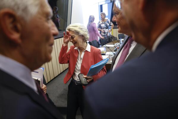 European Commission President Ursula von der Leyen gather with EU commissioners prof to a meeting at the European Parliament in Strasbourg, eastern France, Tuesday, Sept. 13, 2022. (AP Photo/Jean-Francois Badias)