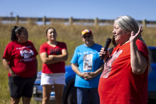 *Kaysera Stops Pretty Places' grandmother, Yolanda Fraser speaks during a dedication ceremony for a billboard in support of the Missing and Murdered Indigenous People movement on Tuesday, Aug. 29, 2023, along I-90 in Hardin, Mont. (AP Photo/Mike Clark)