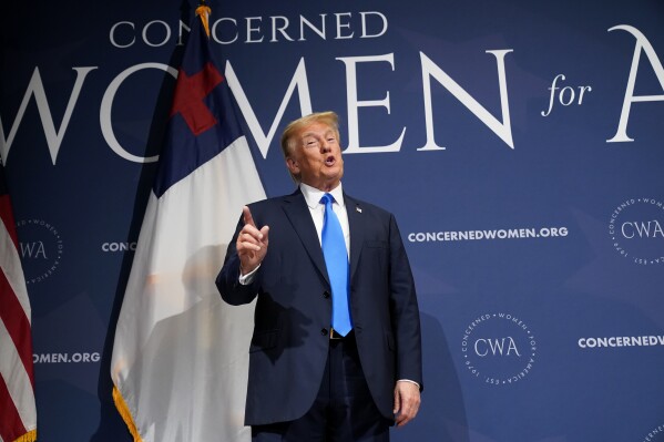 Former President Donald Trump stands on stage before speaking at a Concerned Women for America Summit at the Capitol Hilton, Friday, Sept. 15, 2023, in Washington. (AP Photo/Andrew Harnik)