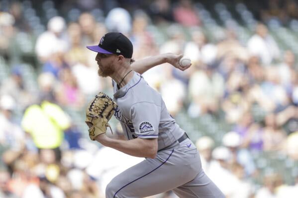Brewers and Hiura top Rockies in 11th