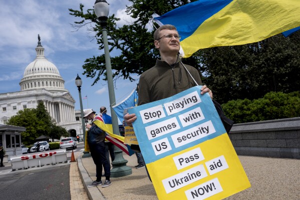 FILE - Activists supporting Ukraine, demonstrate outside the Capitol in Washington, April 20, 2024. The Senate is returning to Washington to vote on $95 billion in war aid to Ukraine and Israel. They are taking the final steps in Congress to send the legislation to President Joe Biden's desk after months of delays and contentious internal debate over how involved the United States should be abroad. (AP Photo/J. Scott Applewhite)