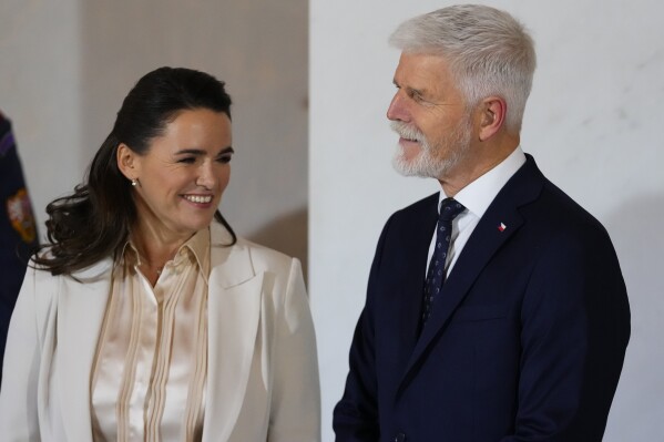 Czech Republic's President Petr Pavel, right, welcomes Hungarian President Katalin Novak, left, for the V4 Summit in Prague, Czech Republic, Wednesday, Nov. 22, 2023. (AP Photo/Petr David Josek)