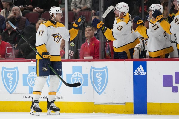 Nashville Predators center Mark Jankowski, left, celebrates his goal during the second period an NHL hockey game against the Chicago Blackhawks Tuesday, Dec. 5, 2023, in Chicago. (APPhoto/Erin Hooley)