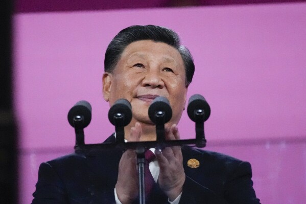 FILE - Chinese President Xi Jinping attends the opening ceremony of the 19th Asian Games in Hangzhou, China, Sept. 23, 2023. The U.S. State Department in a first-of-its-kind report has laid out Beijing's growing efforts to reshape the global narrative on China, while spending billions of dollars to do so. (AP Photo/Lee Jin-man, File)