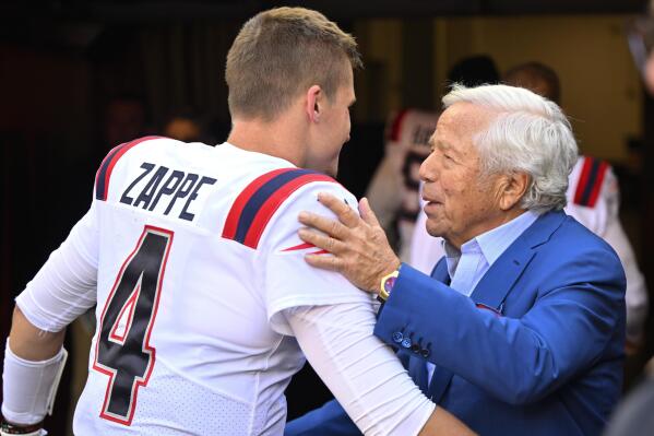 New England Patriots quarterback Bailey Zappe (4) is greeted by team owner Robert Kraft after they defeated the Cleveland Browns in an NFL football game, Sunday, Oct. 16, 2022, in Cleveland. (AP Photo/David Richard)