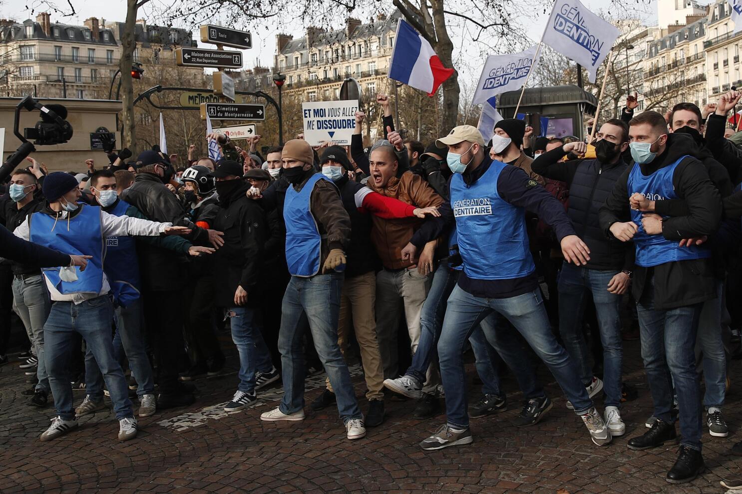 France: Protesters oppose move to disband anti-migrant group | AP News