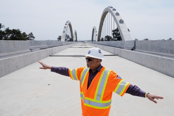 Gars Fernandez, Central Valley Regional Director of the California High Speed Railroad Bureau, discusses the Cedar Viaduct in Fresno, California on Tuesday, April 15th, 2025 (AP Photo/Godofredo A.Vásquez)