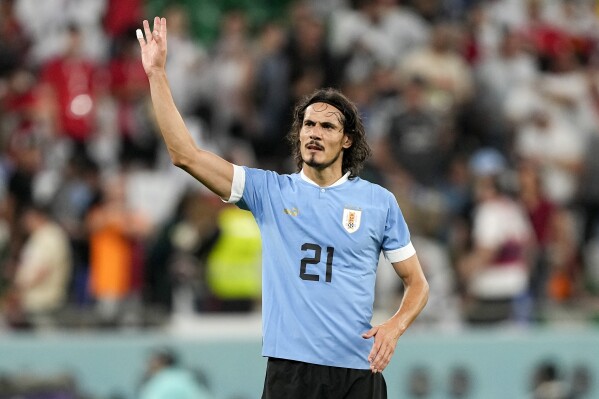 FILE - Uruguay's Edinson Cavani waves to fans after the World Cup group H soccer match between Uruguay and South Korea, at the Education City Stadium in Al Rayyan , Qatar, Thursday, Nov. 24, 2022. Cavani retired from international soccer on Thursday, May 30, 2024, three weeks before the start of the Copa America. (AP Photo/Martin Meissner, File)