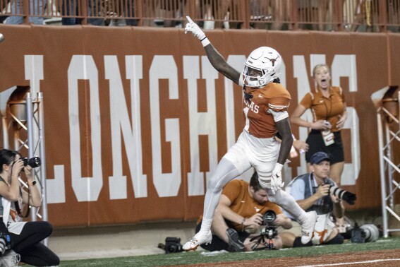 Xavier Worthy celebrates after his touchdown during the second half of an NCAA college football game against Wyoming, Saturday, Sept. 16, 2023, in Austin, Texas. (AP Photo/Michael Thomas)