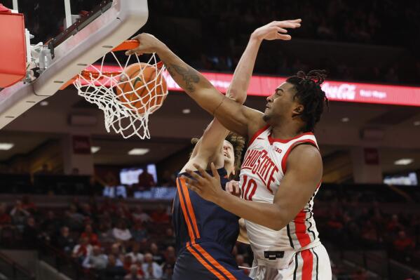 Ohio State's Brice Sensabaugh, right, dunks the ball over Illinois' Matthew Mayer during the second half of an NCAA college basketball game Sunday, Feb. 26, 2023, in Columbus, Ohio. (AP Photo/Jay LaPrete)