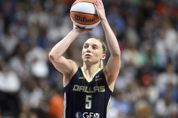Dallas Wing's Paige Bueckers takes an outside shot on basket during a WNBA basketball game against the Connecticut Sun, Tuesday, May 27, 2025, in Uncasville, Conn. (Sarah Gordon/The Day via AP)