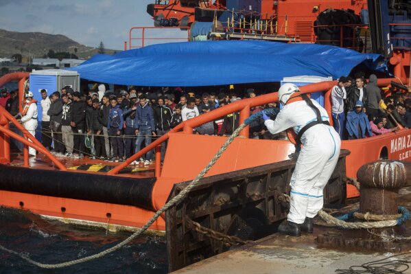 
              In this photo taken on Saturday, Oct. 27, 2018, migrants arrive at the port of San Roque, southern Spain, after being rescued by Spain's Maritime Rescue Service in the Strait of Gibraltar. Spain's maritime rescue service saved 520 people trying to cross from Africa to Spain's shores on Saturday. Also, one boat with 70 migrants arrived to the Canary Islands. Over 1,960 people have died trying to cross the Mediterranean to Europe this year, according to the United Nations. (AP Photo/Marcos Moreno)
            