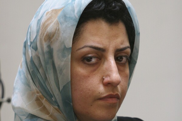 FILE - Prominent Iranian human rights activist Narges Mohammadi attends a meeting on women's rights in Tehran, Iran, on Aug. 27, 2007. A court in Iran has slapped imprisoned Nobel Peace Prize laureate Narges Mohammadi with an additional sentence of 15 months for allegedly spreading propaganda against the Islamic Republic, her family said Monday Jan. 15, 2024. (AP Photo/Vahid Salemi, File)