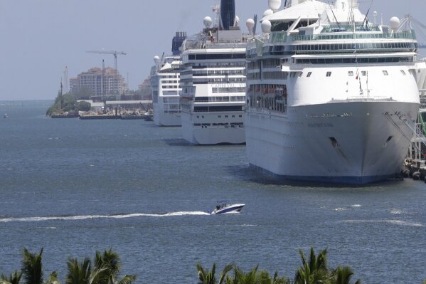 Cruise ships are docked at PortMiami, Monday, Aug. 21, 2017, in Miami. (AP Photo/Lynne Sladky)