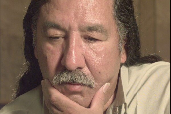 FILE - American Indian activist Leonard Peltier speaks during an interview at the U.S. Penitentiary at Leavenworth, Kan., April 29, 1999. Peltier, who has spent most of his life in prison in the 1975 killings of two FBI agents in South Dakota, has a parole hearing Monday, June 10, 2024, at a federal prison in Florida. (Joe Ledford/The Kansas City Star via AP, File)