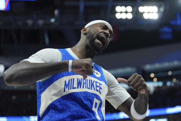 Milwaukee Bucks' Bobby Portis reacts after his three pointer during the first half of an NBA basketball game Sunday, March 17, 2024, in Milwaukee. (AP Photo/Morry Gash)