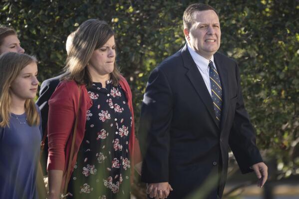 Former Portage, Ind., Mayor James Snyder and his family arrive to Federal Court in Hammond, Ind., for his sentencing on bribery and tax violation charges Wednesday, Oct. 13, 2021. (Kyle Telechan/Chicago Tribune via AP)