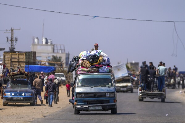 Displaced Palestinians arrive in central Gaza after fleeing from the southern Gaza city of Rafah in Deir al Balah, Gaza Strip, on Thursday, May 9, 2024. The Israeli army has ordered tens of thousands of people to evacuate Rafah as it conducts a ground operation there. (AP Photo/Abdel Kareem Hana)