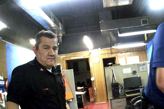 FILE - This image from Marion, Kan., Police Department body camera video provided by the McDonald Tinker law firm shows former Marion Police Chief Gideon Cody during his department's raid of the Marion County Record newspaper on Aug. 11, 2023, in Marion, Kan. (McDonald Tinker via AP)