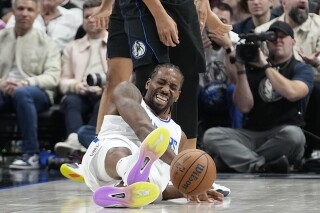 Los Angeles Clippers forward Kawhi Leonard hits the floor hard during the second half of an NBA basketball game against the Dallas Mavericks in Dallas, Wednesday, Dec. 20, 2023. (AP Photo/LM Otero)