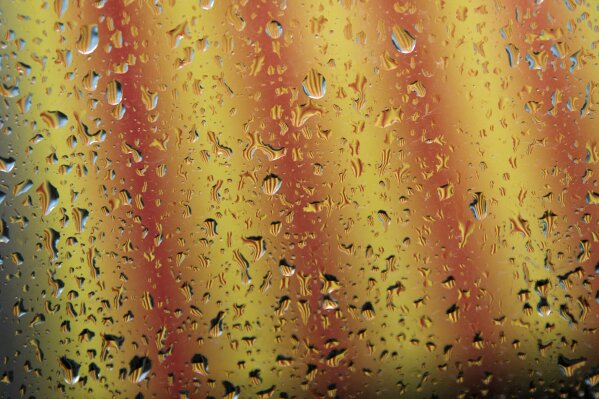 
              A Catalan flag is seen reflected on drops of water from rain in Barcelona, Spain, Thursday, Oct. 19, 2017. Spain's government on Thursday immediately rejected a threat by Catalonia's leader to declare independence unless talks are held, calling a special Cabinet session for the weekend to activate measures to take control of the region's semi-autonomous powers. (AP Photo/Emilio Morenatti)
            
