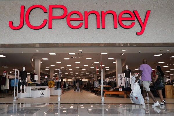The JCPenney sign lights up the entrance to a store in Frisco, Texas, Wednesday, Aug. 30, 2023. The retailer is reinvesting more than $1 billion into the storied but troubled 121-year-old department store business by the end of 2025 to remodel its stores, upgrade its online shopping site and app and make its supply network more efficient to speed up online shipping among other plans. (AP Photo/LM Otero)