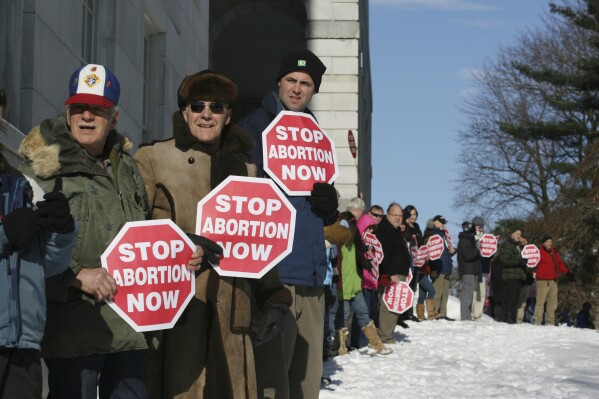 FILE - Participants in the annual anti-abortion rally surround the state house in Augusta, Maine, Jan. 14, 2012. An effort to amend the Maine Constitution to enshrine the right to an abortion is coming up short. The measure fell shy of a two-thirds majority in the Maine House Tuesday, April 9, 2024 failing to clear the hurdle for sending the amendment to voters for ratification. (AP Photo/Joel Page, File)