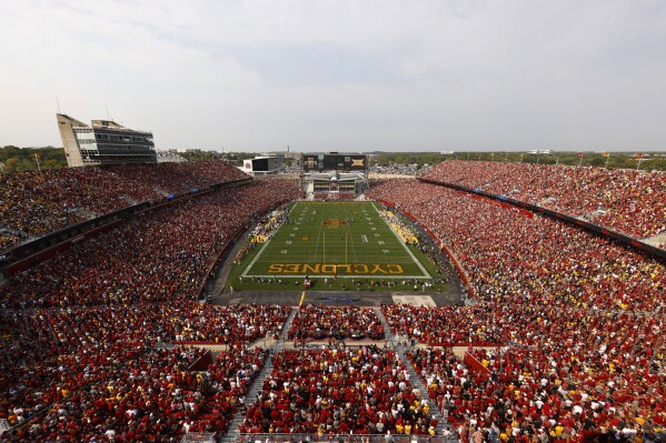 FILE - Iowa State takes on Iowa in a sellout crowd of 61,500 people at Jack Trice Stadium during the first half of an NCAA college football game, Saturday, Sept. 11, 2021, in Ames, Iowa. Iowa State athletes caught in a gambling sting last year were criminally charged and lost NCAA eligibility as a result of improper searches into their online wagering activities, according to defense attorneys' court filings. (AP Photo/Matthew Putney, File)